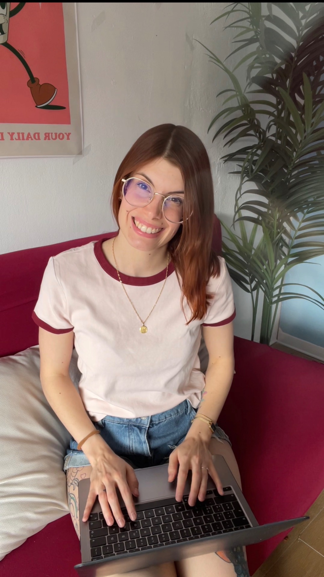 Sara Angelicchio, freelance web & graphic designer, working on her laptop